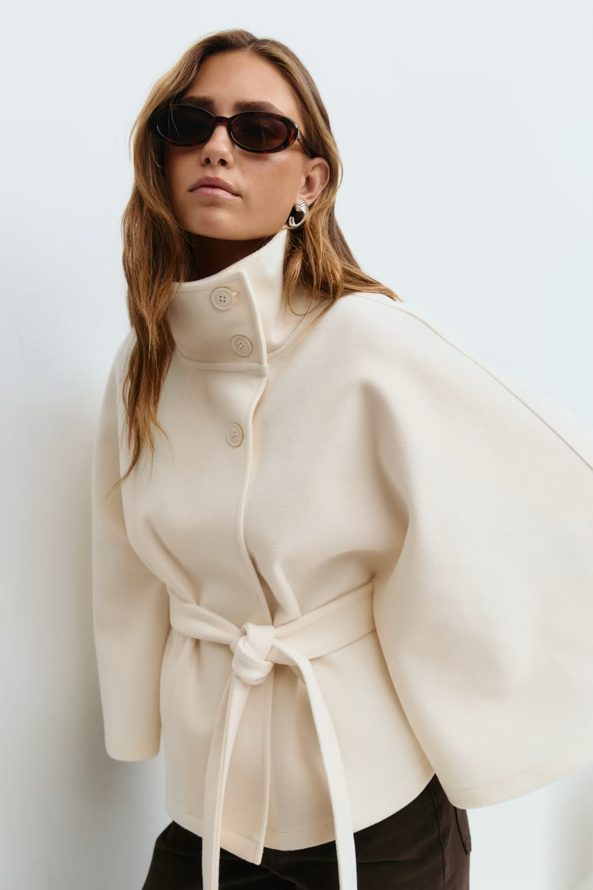 white_belt_coat_1.png — White wool-blend belted cape coat front view
